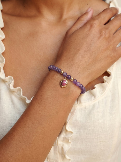 Amethyst Crown Chakra Charm Bracelet worn on wrist