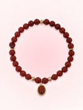 Garnet Root Chakra Charm Bracelet with gold-tone charm