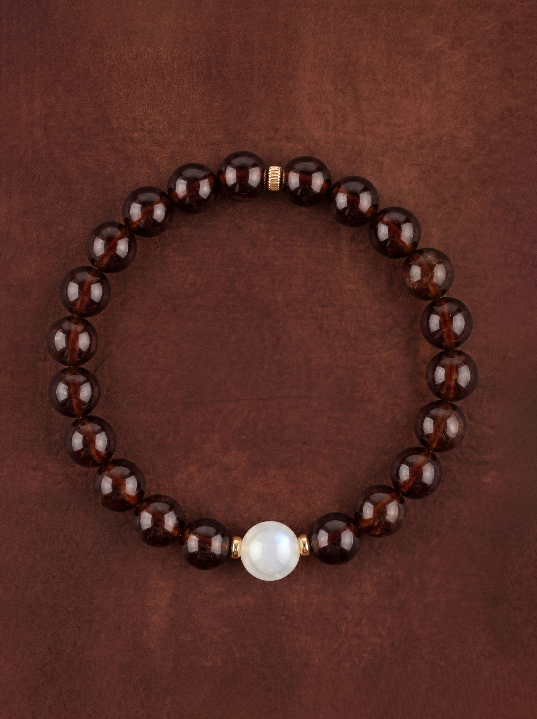 Garnet Moonstone Accent Bracelet with a pale focal bead