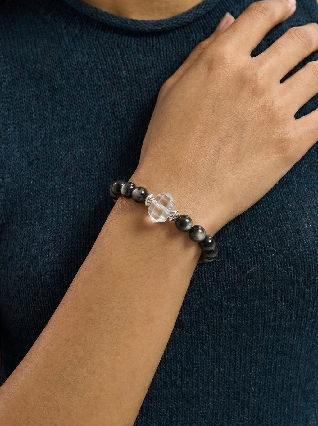 Silver Obsidian Clear Quartz Root Chakra Accent Bracelet worn on wrist