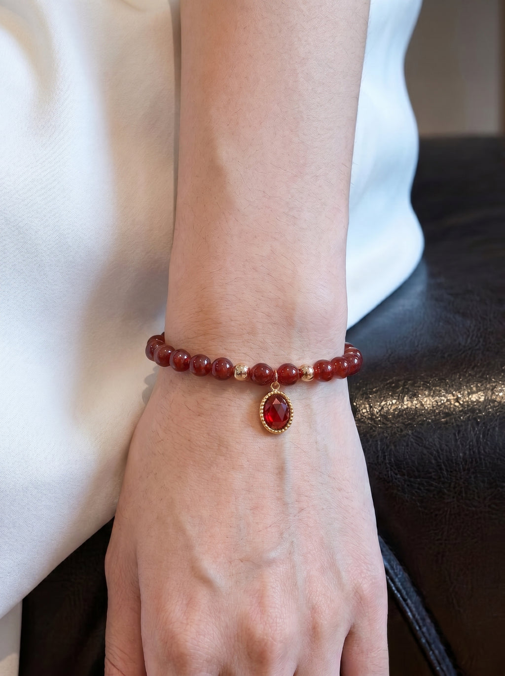 Garnet Root Chakra Charm Bracelet worn on wrist