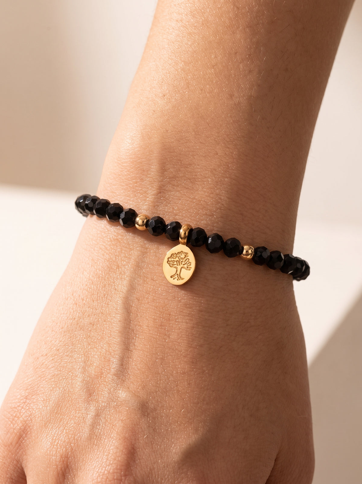 Black Obsidian Root Chakra Slim Bracelet worn on wrist