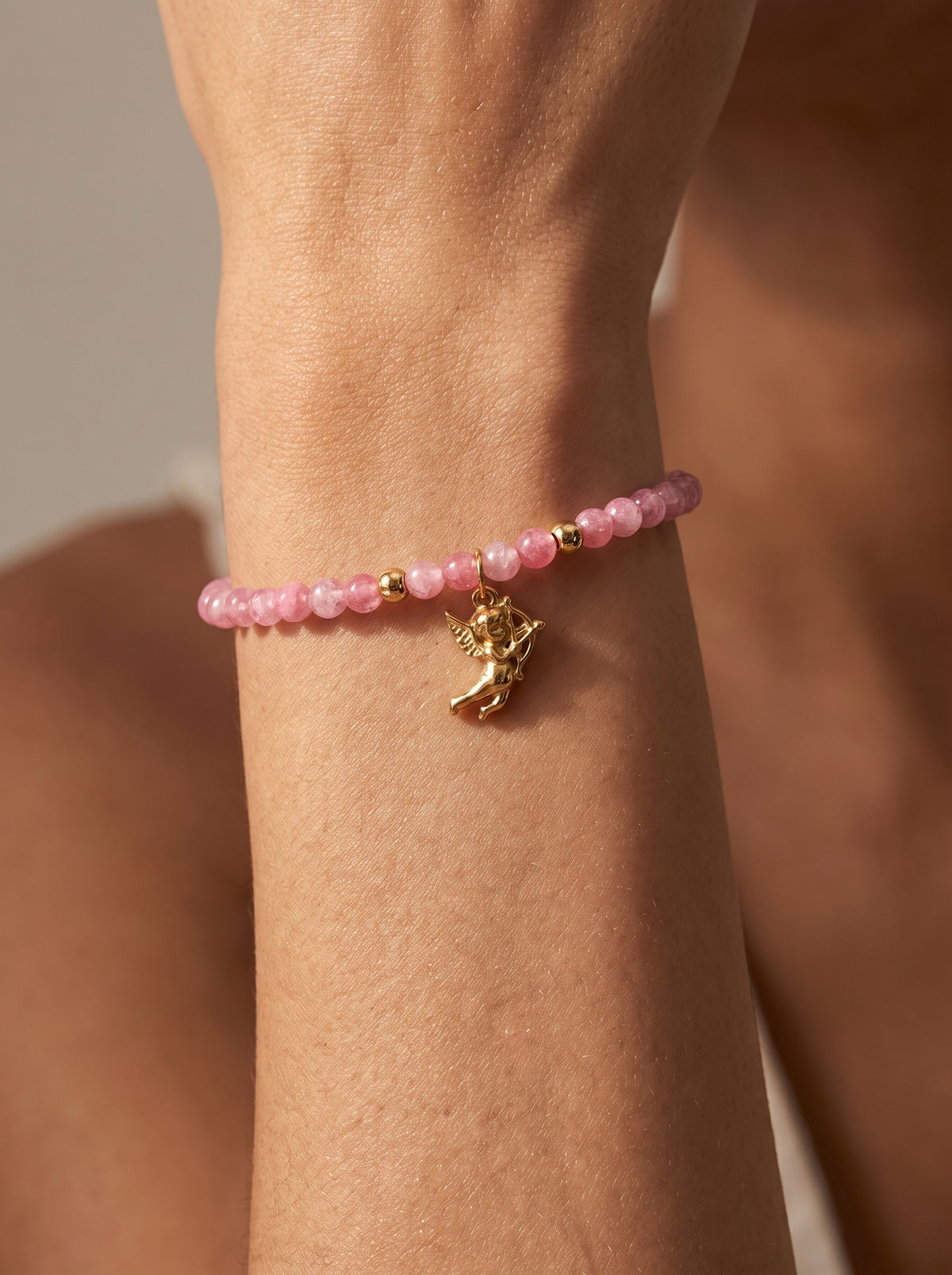 Rhodonite Heart Chakra Angel Charm Bracelet worn on wrist